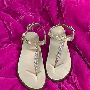 Bionic gold sandals with beautiful gems
